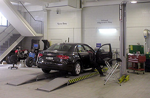 Car after driving up ramps of 4 Post hoist 