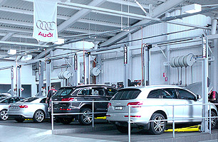 Automotive workshop fit-out with lubrication hose reels mounted in between service bays, Audi Parramatta