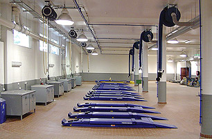 Scissor lifts installed in multi service bay auto workshop