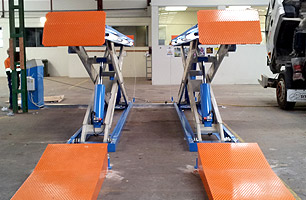 Scissor Lift in full rise position installed at SITA Environmental VIC