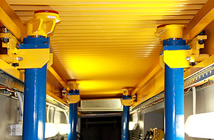 2 Sets of Hartex pit jacks shown from underneath suspended ceiling pit with pit safety cover