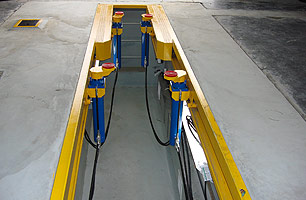 Finished workshop pit, with jacks, lighting & ventilation